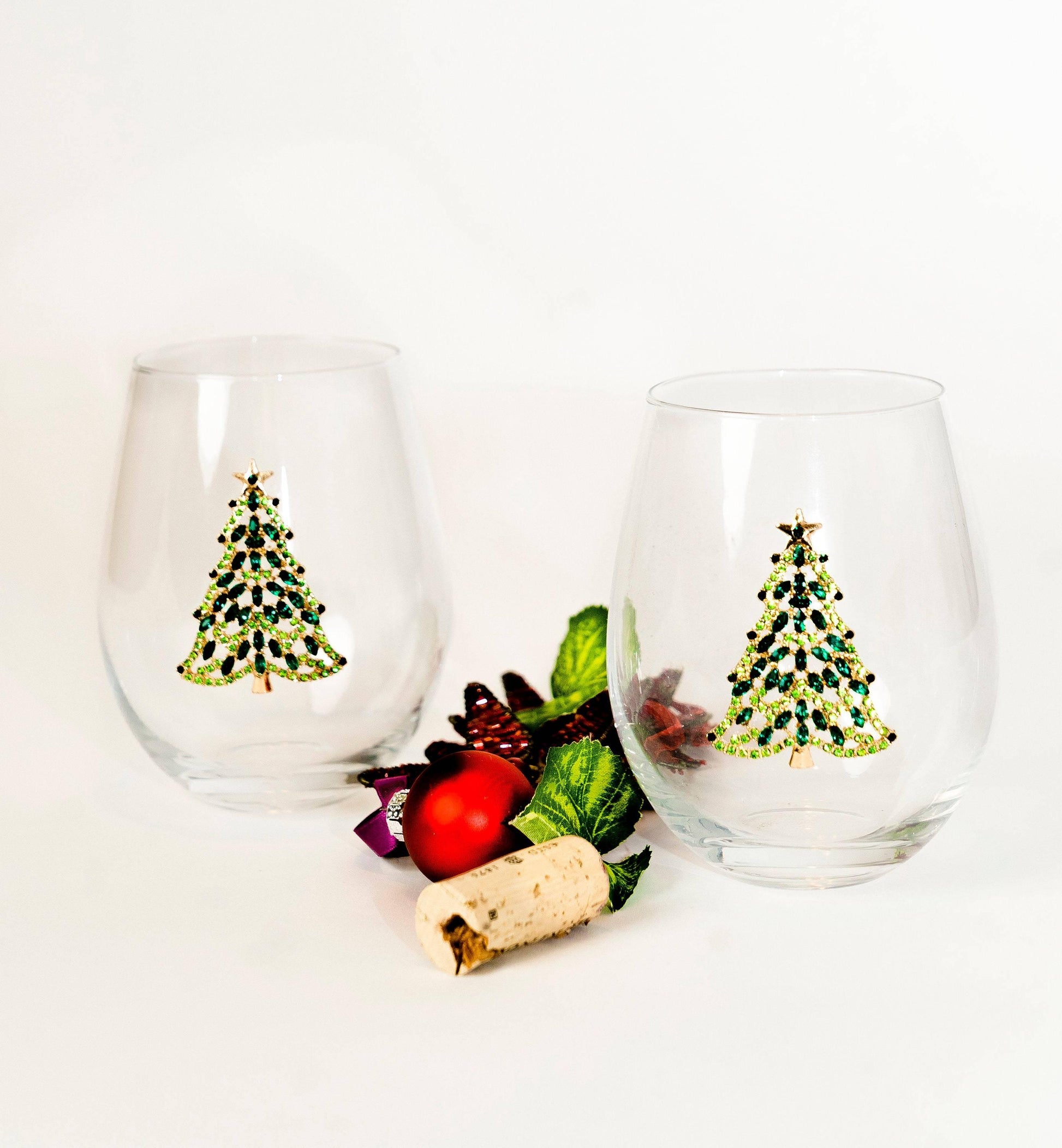 https://jerseyartglass.com/cdn/shop/products/jersey-art-glass-christmas-tree-stemless-wine-glass-set-of-2-christmas-wine-glasses-32394834247844.jpg?v=1699104833&width=1946